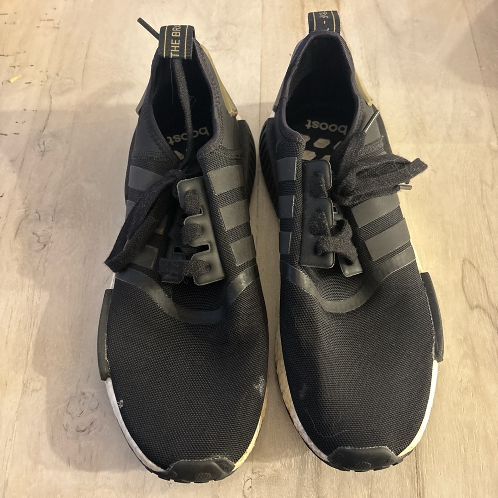 Black and green Adidas NMD R1 trainers